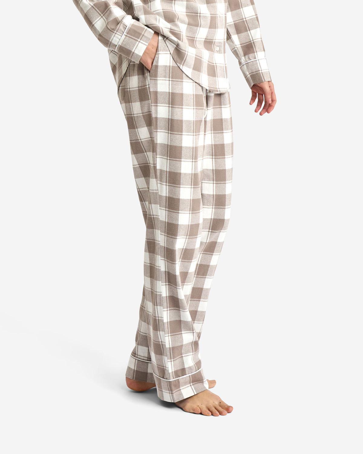 Rutiga pyjamasbyxor i ekologisk bomull med elastisk midja och dragsko för mjuk, avslappnad komfort.